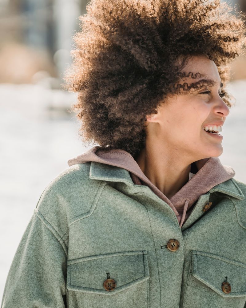 Smiling woman with curly hair