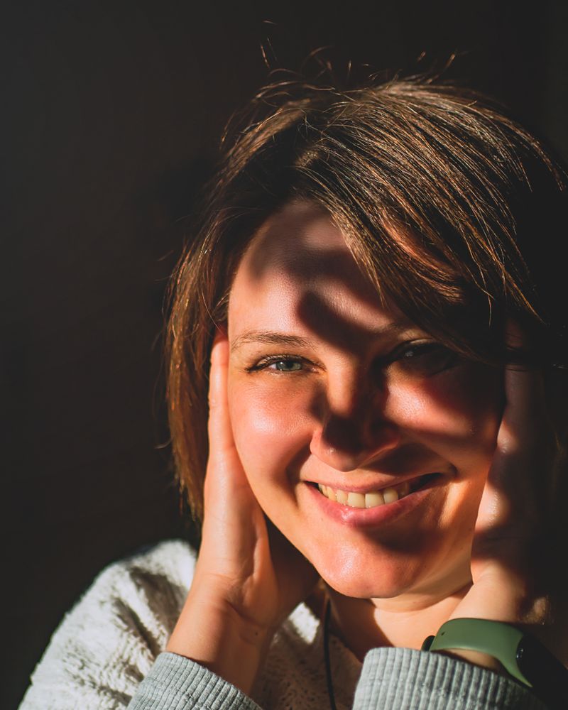 Smiling woman in warm sunlight