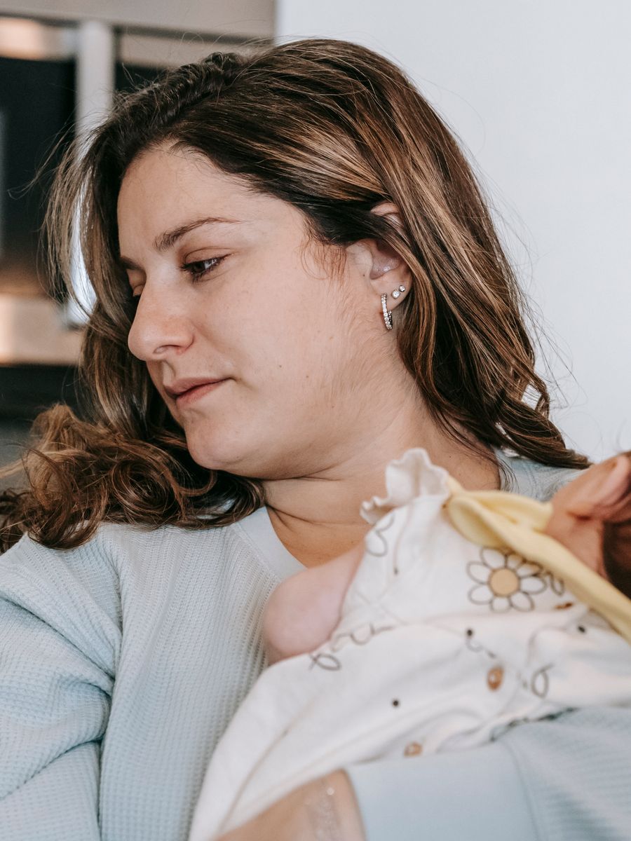 New mother holding her baby close